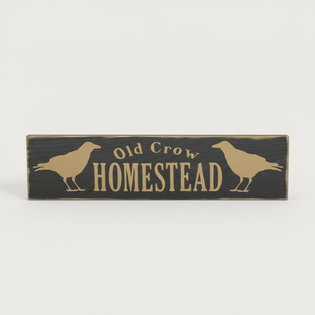 Wooden sign with 'Old Crow Homestead' text and crow illustrations on a white background