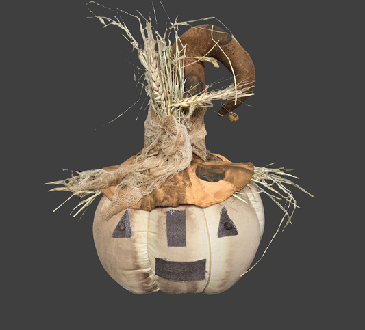 Pumpkin head with witch hat and straw on a grey background