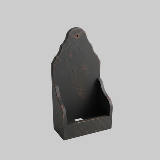 Black wooden sconce on a light gray background