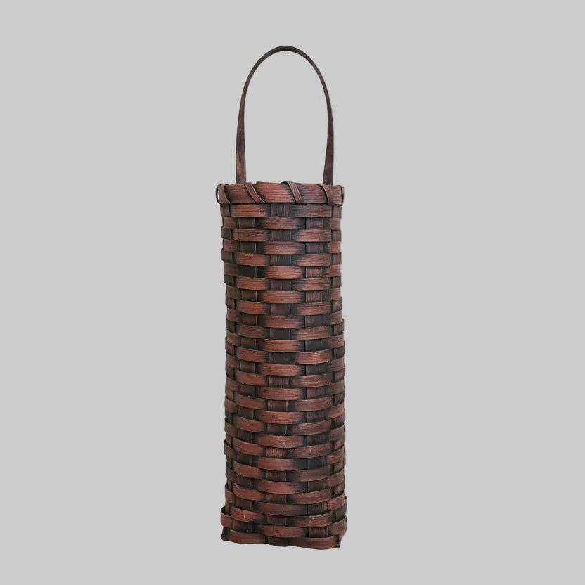 Decorative basket with woven design on a wooden surface