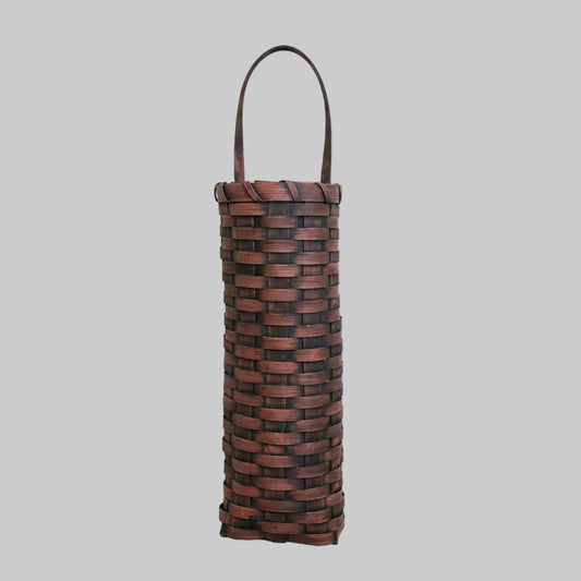 Decorative basket with woven design on a wooden surface