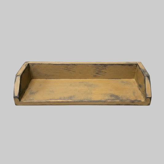 A rectangular wooden box with a distressed yellow-brown finish and raised sides.
