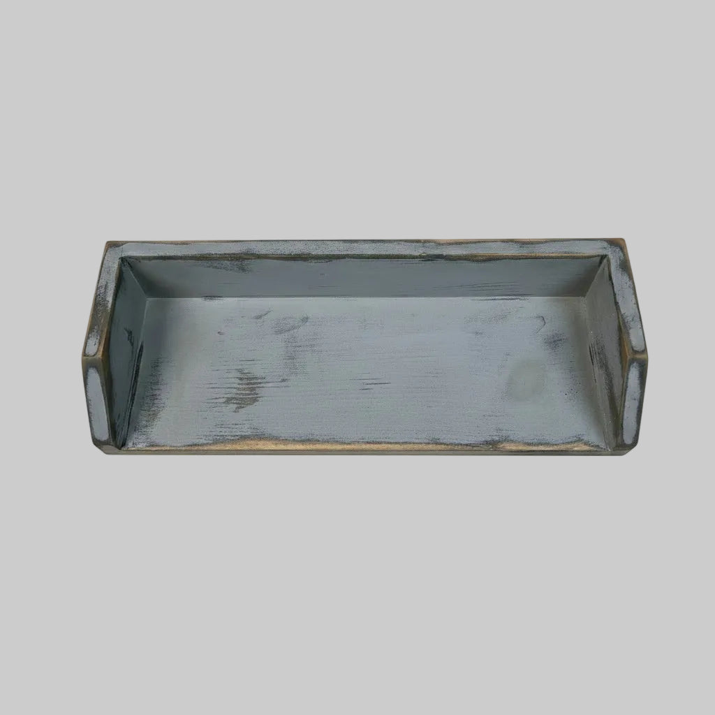 A rectangular gray tray with a raised rim, shown from above.