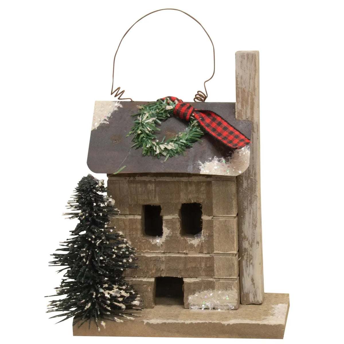Wooden birdhouse with a wreath and tree on a white background