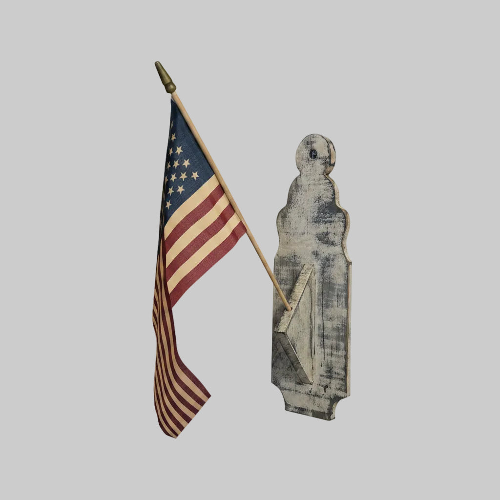 Wooden accessory holding an American flag on a gray background