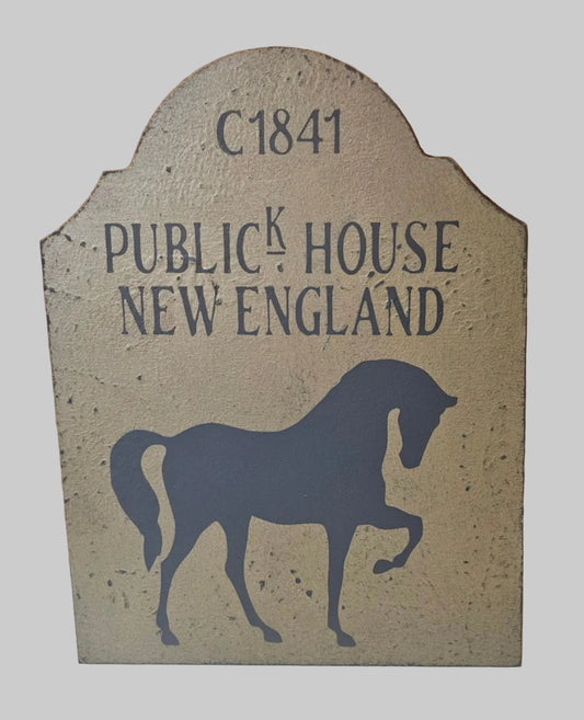 Decorative sign with horse silhouette and text 'C1841 Publick House New England' on a beige background