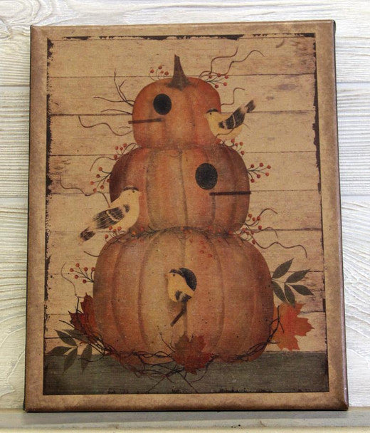 A rectangular decorative wall sign featuring a stacked pumpkin design with small birds, leaves, and autumn berries on a distressed wood plank background.