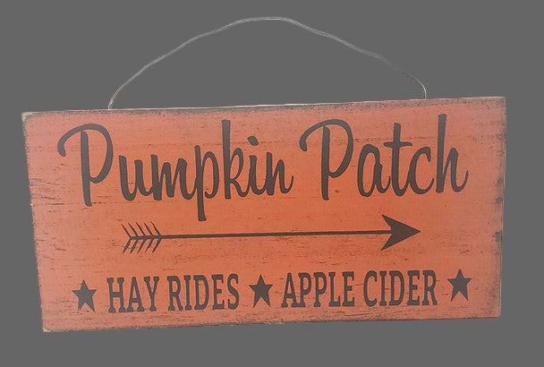 Wooden sign with 'Pumpkin Patch' text and arrow on a white background
