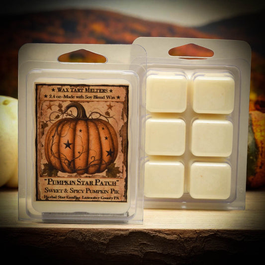 Pumpkin-themed wax tart melt packaging with a warm glow.