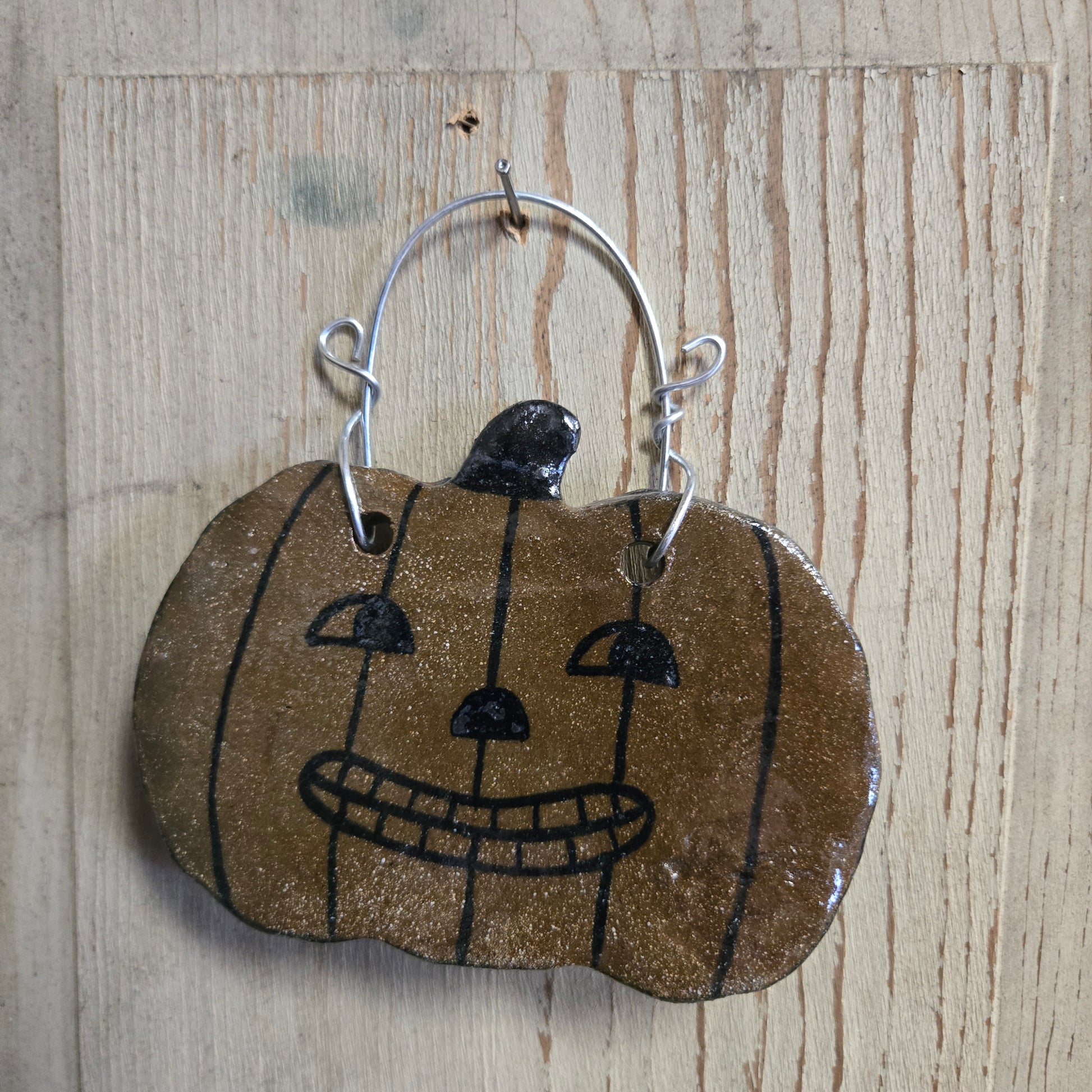 Ceramic pumpkin on a hanger
