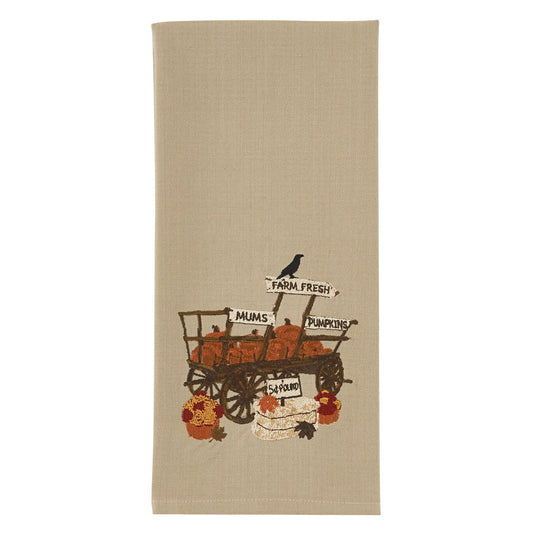 Pumpkin wagon embroidered dishtowel on white background
