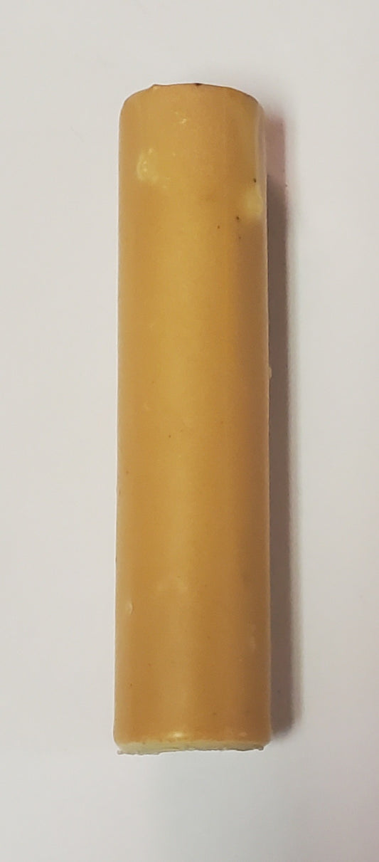A single real beeswax sleeve against a white background, showing a smooth, yellowish hue.