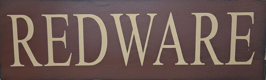 Wooden sign with 'REDWARE' text on a dark brown background