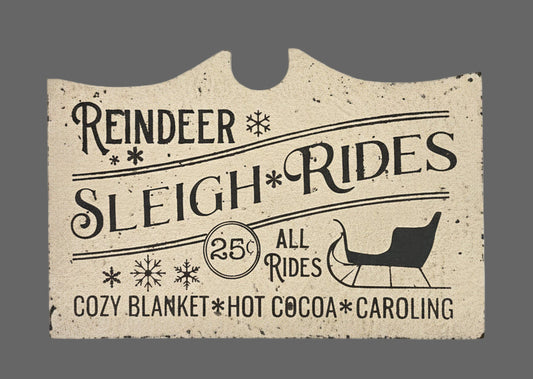 Advertisement for reindeer sleigh rides with text and a silhouette of a sleigh on a gray background.