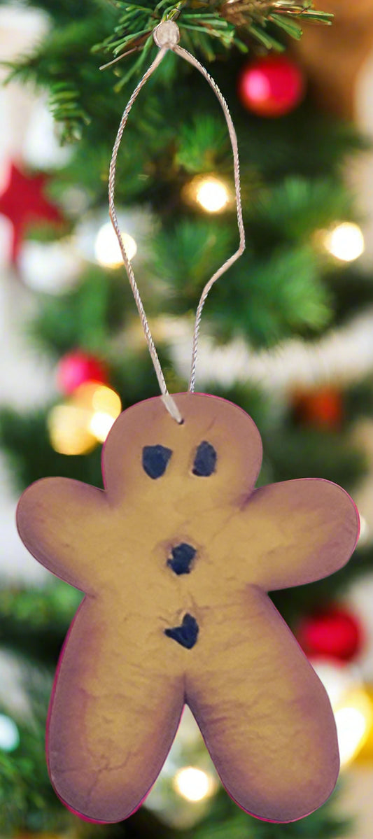 Resin gingerbread man ornament on white background