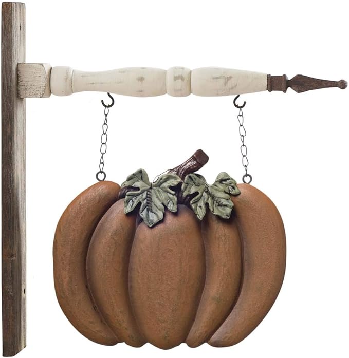 Orange pumpkin hanging from a white arrow.