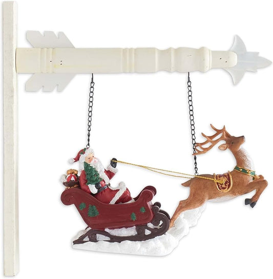 Decorative Christmas ornament with Santa Claus in a sleigh pulled by a reindeer.