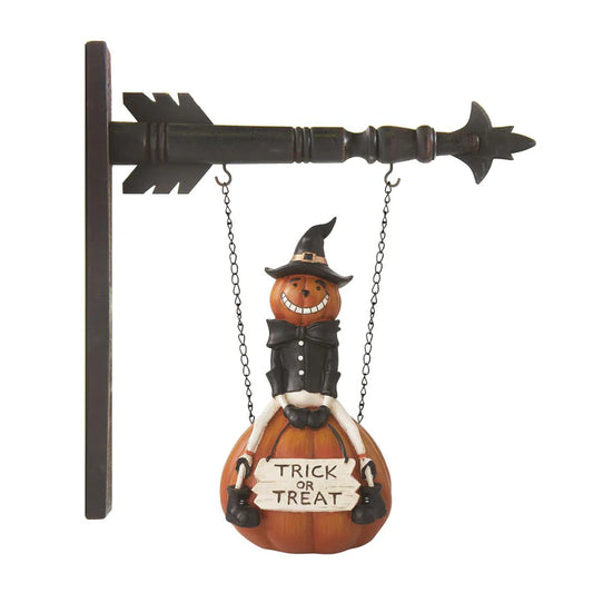 Halloween-themed decoration with a pumpkin character holding a 'Trick or Treat' sign on a white background.