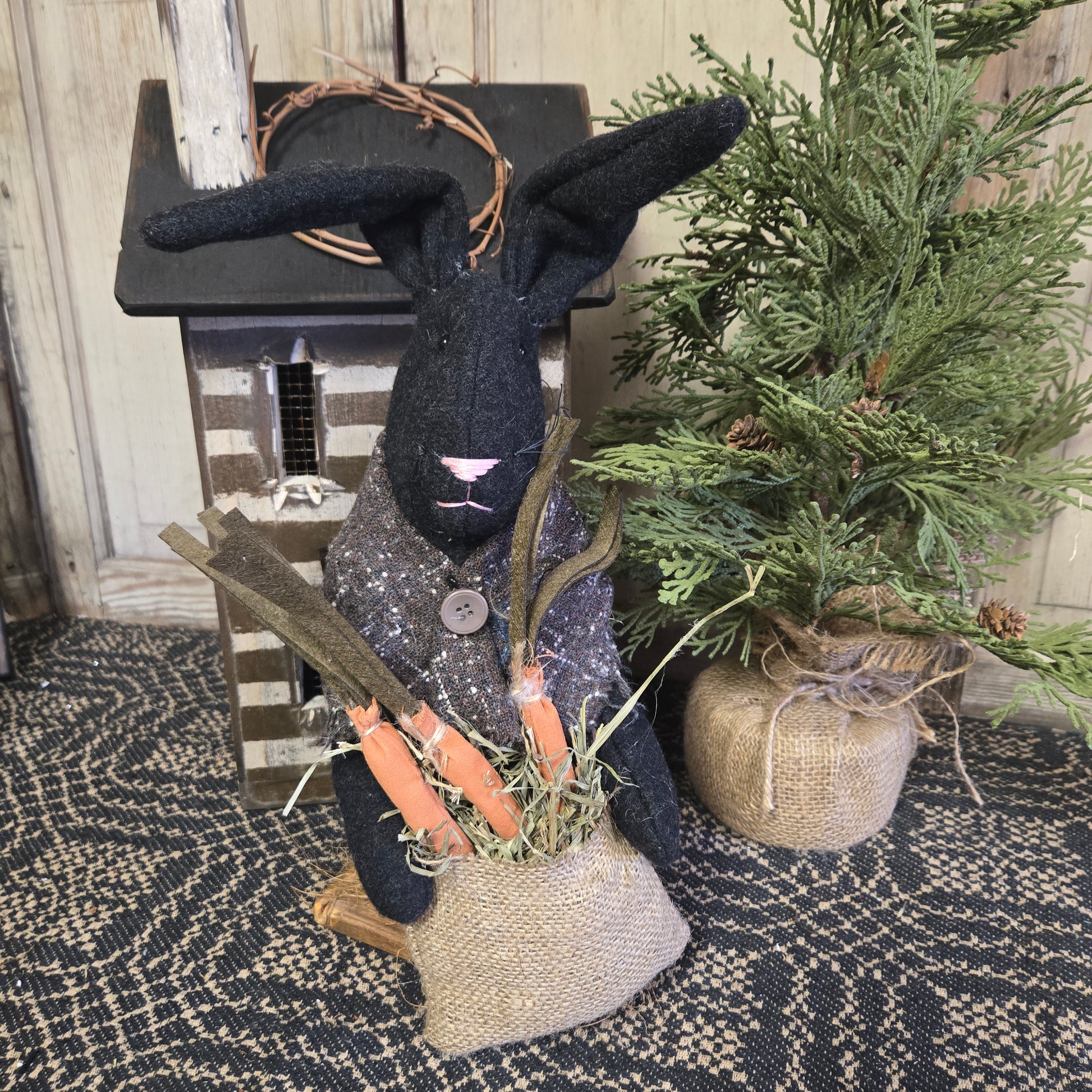 Primitive Black Bunny Holding Bag of Carrots