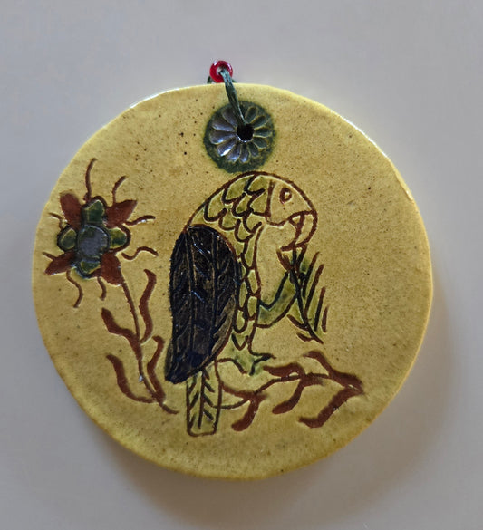Redware bird round ornament on white background