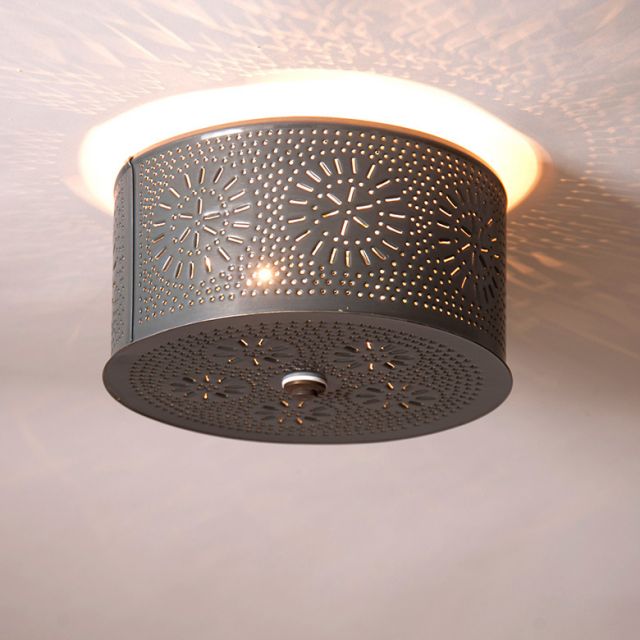Decorative ceiling light fixture with intricate design on a neutral background