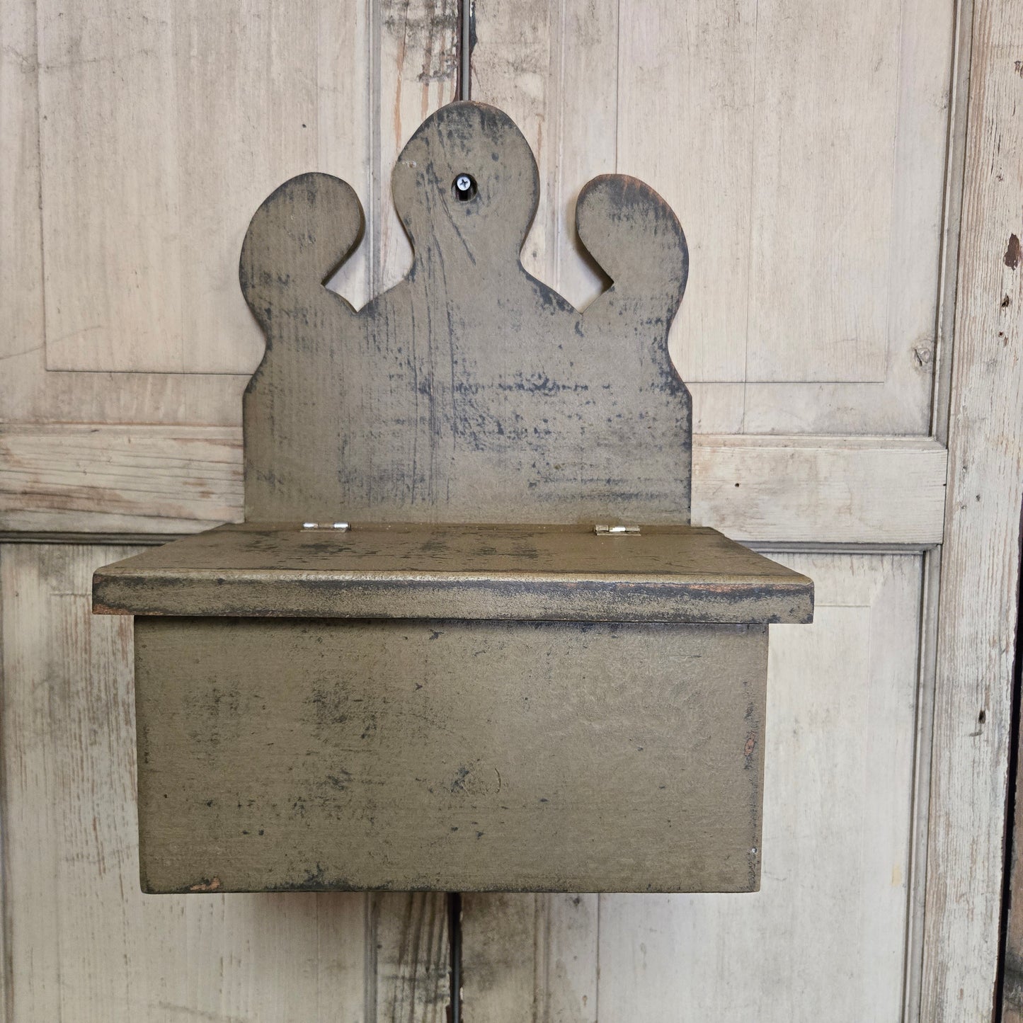 Wooden box with a unique design on a wooden floor