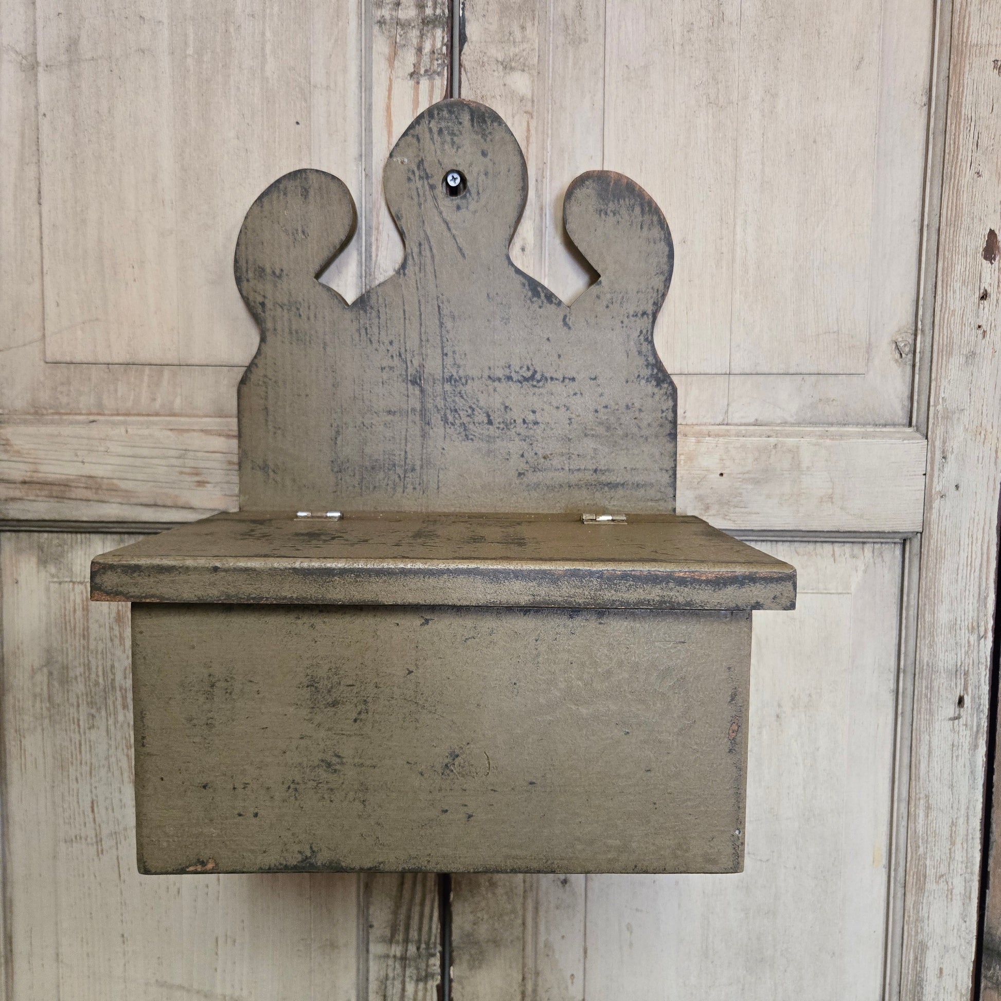 Wooden box with a unique design on a wooden floor
