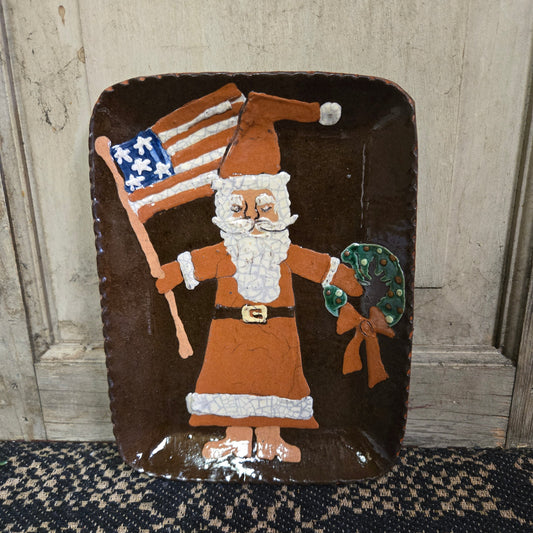 Rectangular redware plate with Santa, flag and wreath motif