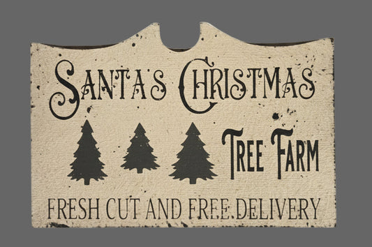 Decorative sign with 'Santa's Christmas Tree Farm' text and tree illustrations on a textured background.