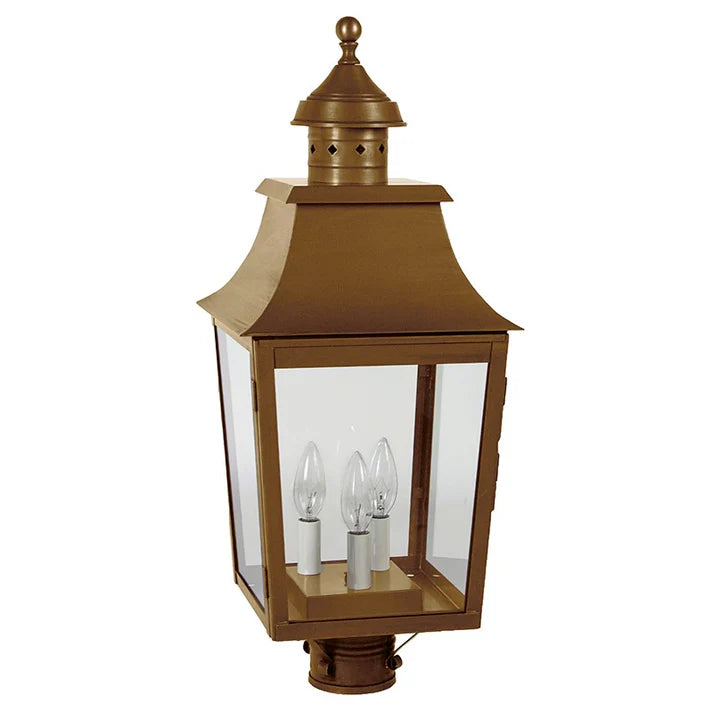 Bronze outdoor lantern with clear glass panels on a gray background