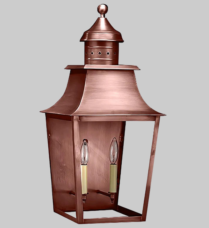 Copper outdoor lantern with two candle-like lights on a gray background