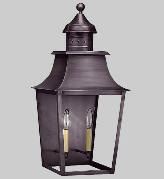 Decorative outdoor lantern with two candle-like lights on a gray background