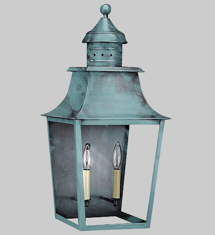 Vintage-style lantern with a metallic finish on a gray background