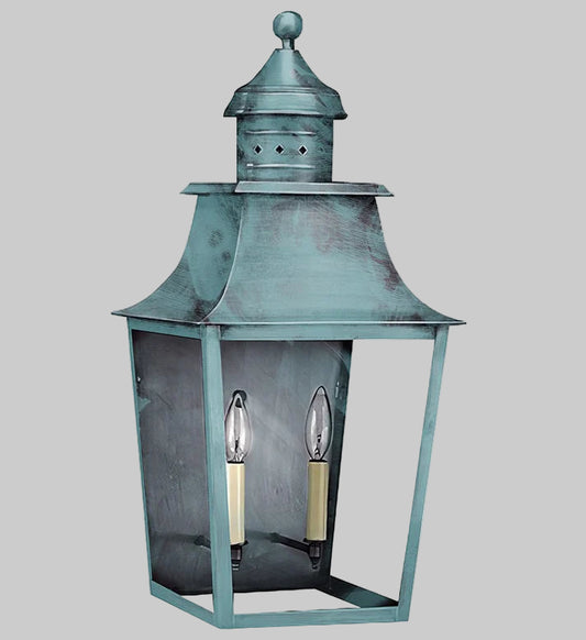 Vintage-style lantern with a metallic finish on a gray background