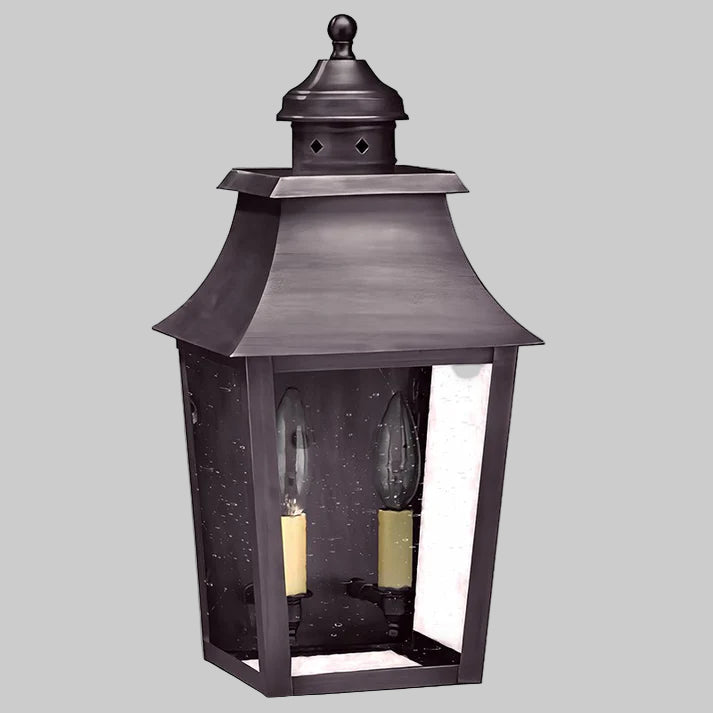 Decorative outdoor lantern with a dark finish on a gray background