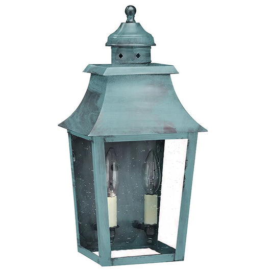 Decorative outdoor lantern with a metallic finish on a white background