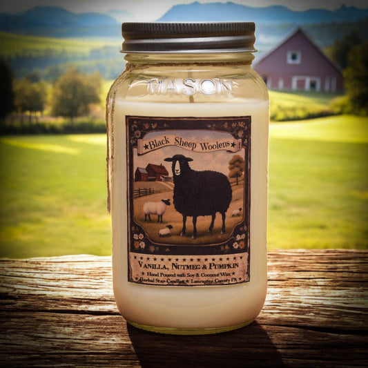 Jar of candle with 'Black Sheep Woolens' label against a scenic background
