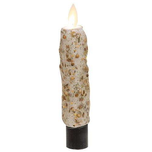 Decorative candle with textured surface and flame on a white background