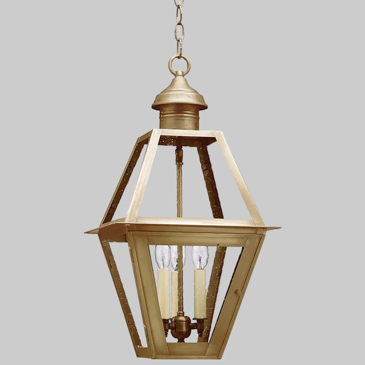 Gold pendant light fixture on a white background