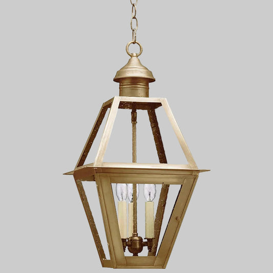Gold pendant light fixture on a white background