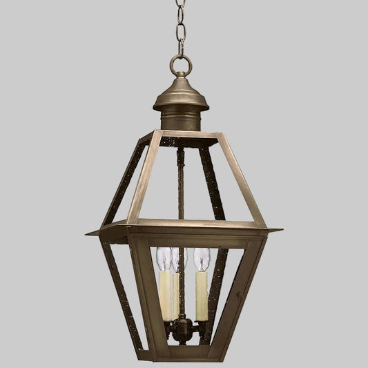 Bronze hanging lantern with two candles on a white background