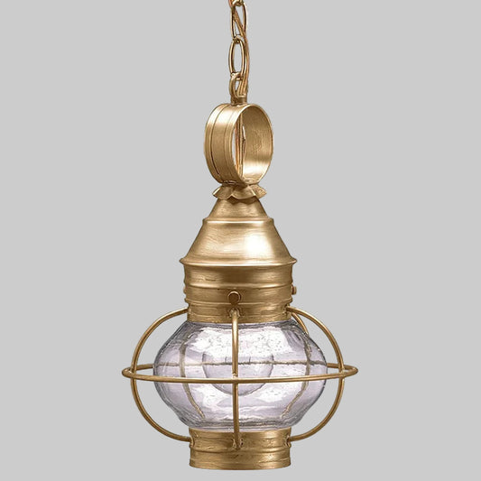 Brass pendant light with clear glass shade on a gray background