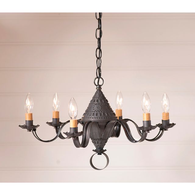 Black wrought iron chandelier with six candles on a beige background