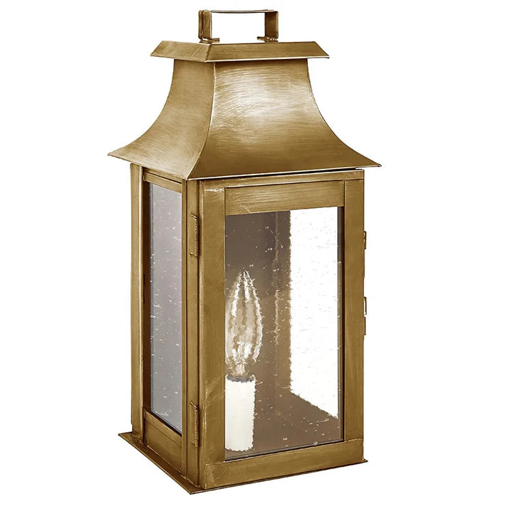Gold lantern with a clear glass cover on a white background