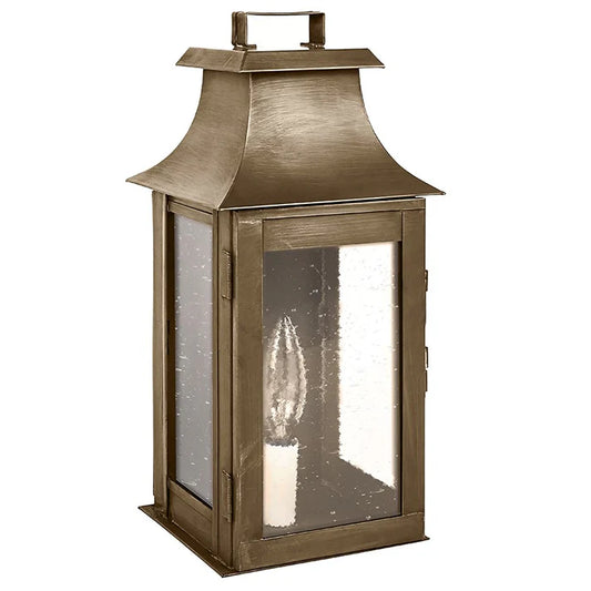 Bronze lantern with glass panels on a white background