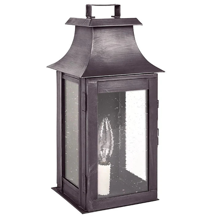 Decorative lantern with a candle inside on a white background