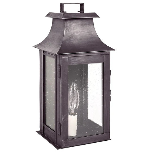 Decorative lantern with a candle inside on a white background