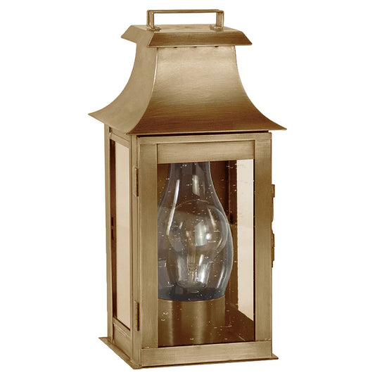 Bronze lantern with clear glass shade on a white background