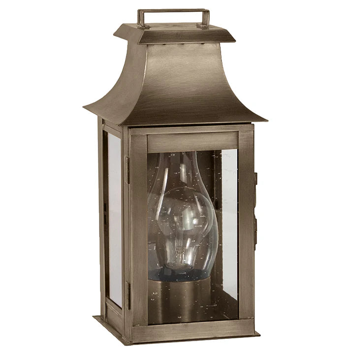 Bronze outdoor lantern with clear glass on a white background