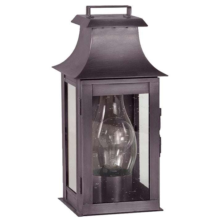 Decorative lantern with a clear glass shade on a white background